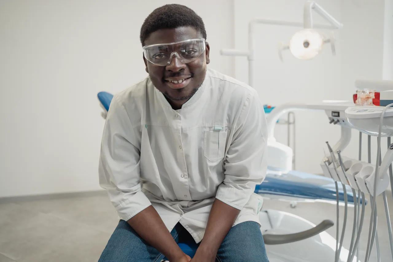 A smiling dentist in a bright clinic